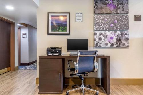 an office with a desk with a computer and a chair at Sleep Inn & Suites in Johnson City