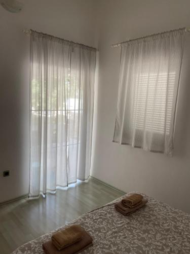 Postel nebo postele na pokoji v ubytování Apartmani Leskovar