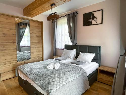 Posteľ alebo postele v izbe v ubytovaní VisitZakopane - Baron Apartment