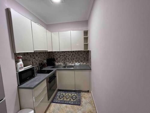 Η κουζίνα ή μικρή κουζίνα στο TEA Summer Apartment