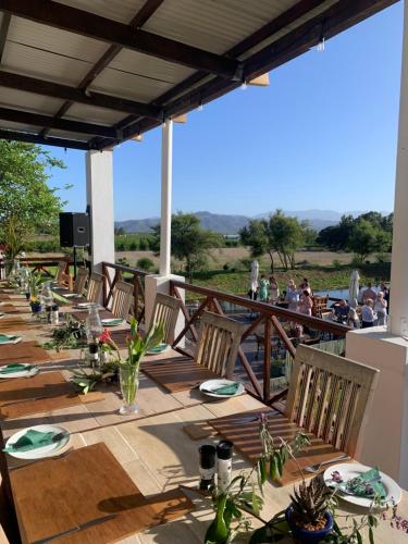 a group of tables and chairs on a patio at theLAB Robertson in Robertson