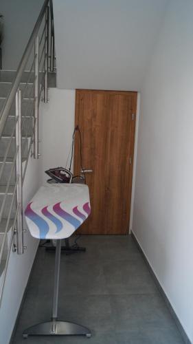 a stairway with a chair in a room at Pokoje do wynajęcia in Tomaszów Mazowiecki