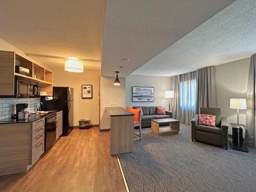 a large living room with a kitchen and a living room at Candlewood Suites Indianapolis Downtown Medical District, an IHG Hotel in Indianapolis