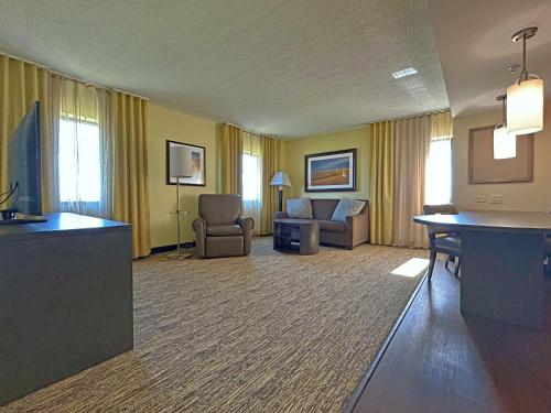 a large hotel room with a living room at Candlewood Suites Indianapolis Downtown Medical District, an IHG Hotel in Indianapolis