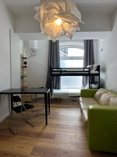 a living room with a bunk bed and a couch at Glass Boutique - Rooms & Suites in Marinha Grande