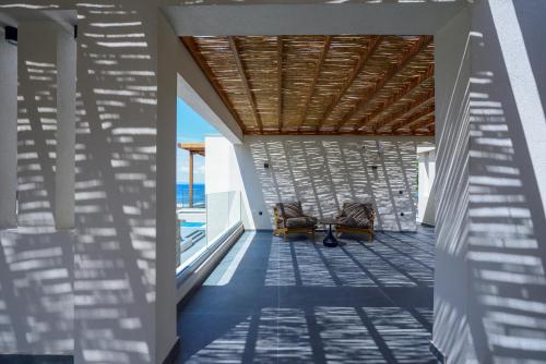 a view from the hallway of a house with a wooden ceiling at Amyntas Seafront Hotel in Neos Marmaras