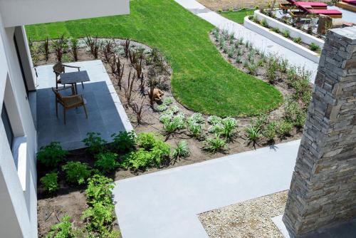an overhead view of a garden with a lawn at Amyntas Seafront Hotel in Neos Marmaras