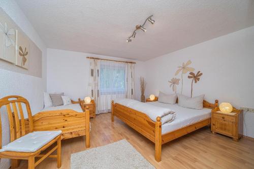 Postel nebo postele na pokoji v ubytování Ferienwohnung Lisi