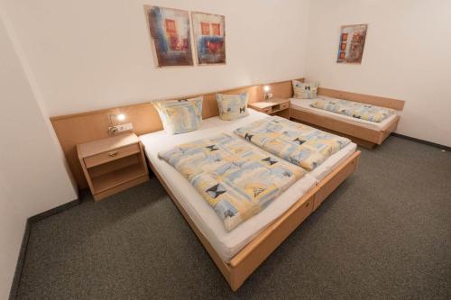 a bedroom with two beds and two night stands at Appartement Montanea in Schruns