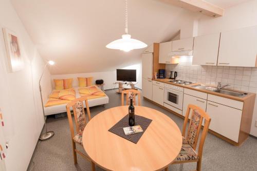 a kitchen and dining room with a table in a room at Appartement Montanea in Schruns-Tschagguns