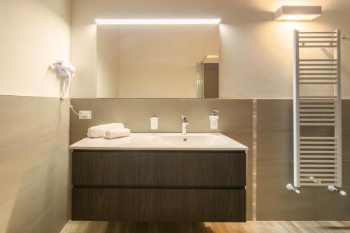 a bathroom with a sink and a mirror at Podere La Quercia in San Gimignano