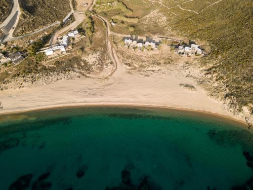 an aerial view of a beach with houses and the water at Ammoa Beach Residences in Vayiá