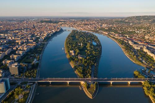 an aerial view of a river with a bridge at Island Hostel Budapest in Budapest