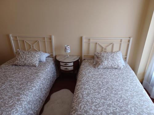 two beds sitting next to each other in a bedroom at Casa Emma in Villamarciel