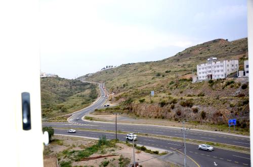 a view of a highway with cars driving down a hill at فندق فربيون ابها - Ferbion Hotel Abha in Abha