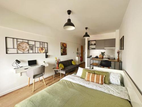 a bedroom with a bed and a desk in a room at ROOM 335 in São Martinho do Porto