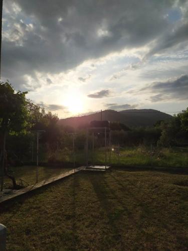 a view of the sunset from a soccer field at Kosta's Cozy Home in Asprovalta
