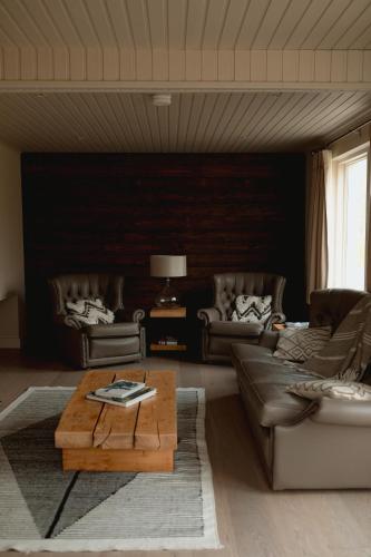 a living room with couches and a coffee table at Finn Lough in Pettigoe
