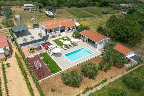an aerial view of a house with a swimming pool at Villa Bepo in Plano