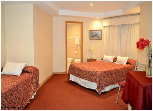 Ένα ή περισσότερα κρεβάτια σε δωμάτιο στο Hotel Guerrero
