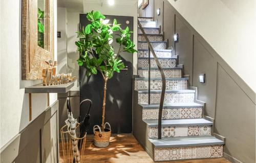 a staircase with a plant in the middle at Cozy Home In Ulmen With Kitchen in Ulmen