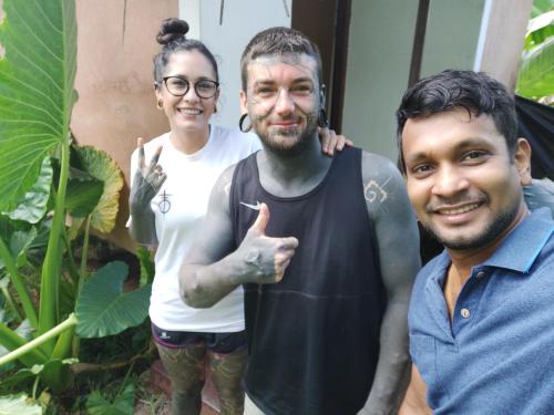 a man and two people posing for a picture at Lake Cabin in Polonnaruwa