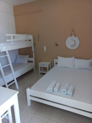 Ένα ή περισσότερα κρεβάτια σε δωμάτιο στο Stafylos Rooms
