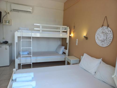 Ένα ή περισσότερα κρεβάτια σε δωμάτιο στο Stafylos Rooms