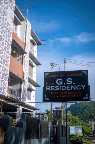a building with a sign for a hotelres residency at GS RESIDENCY in Guwahati