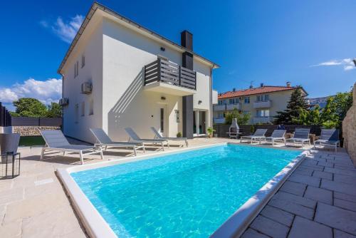 an image of a villa with a swimming pool at Villa BAŠKA near the beach in Baška