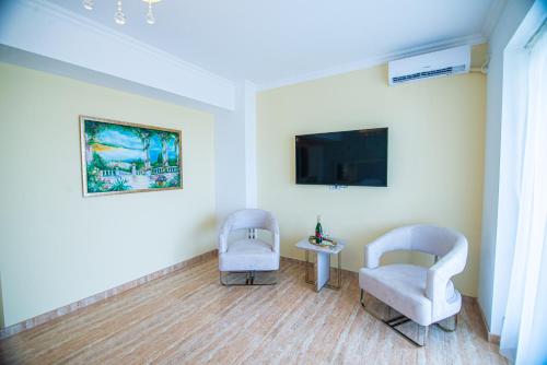 TV a/nebo společenská místnost v ubytování Alessio Hotel Residence