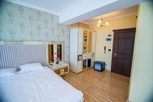 Postel nebo postele na pokoji v ubytování Alessio Hotel Residence