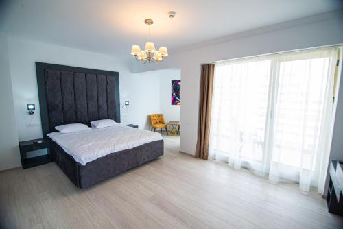 Postel nebo postele na pokoji v ubytování Alessio Hotel Residence