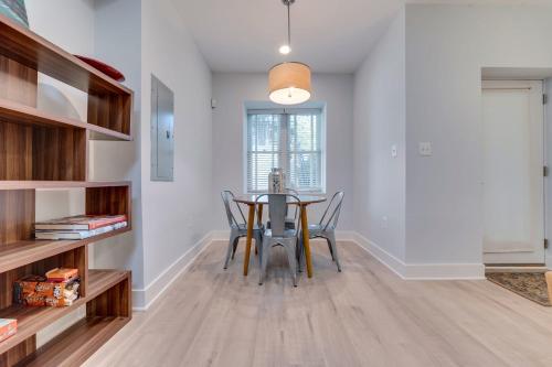 a dining room with a table and chairs at Luxe Townhouse Flat in Hip Neighborhood, Near Metro in Washington, D.C.