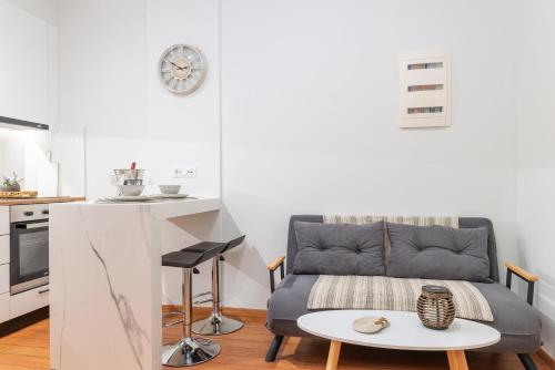 a living room with a couch and a table at Charavgi apartment 2 in Kremasti