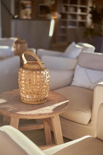 a wicker basket sitting on a table in a store at Villa L'Arche in Bidart