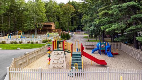 a playground with a slide in a park at Sun Outdoors Saco Old Orchard Beach in Saco