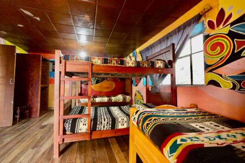 a bedroom with a bunk bed and a bunk bedouble at Refugio Terra Esperanza in Ibarra