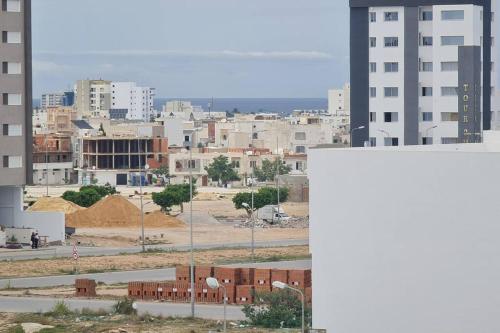 a view of a city with buildings and a street at Appartement Sousse Sahloul 4 in Sousse