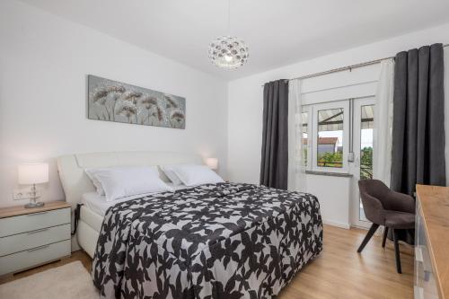 Ένα ή περισσότερα κρεβάτια σε δωμάτιο στο Apartment Flowers
