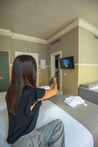 TV a/nebo společenská místnost v ubytování My Story Hotel Tejo