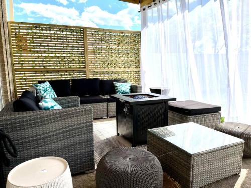 a living room with a couch and a table at The Ultimate Escape. Unpack, Relax, Enjoy!Sleeps14 in Elmhurst
