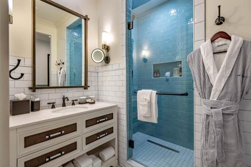 a bathroom with a shower and a sink at Camp Creek Inn in Seacrest
