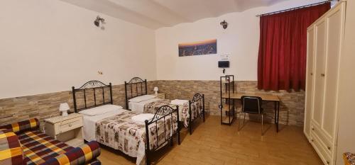 Ένα ή περισσότερα κρεβάτια σε δωμάτιο στο La casa di Minù