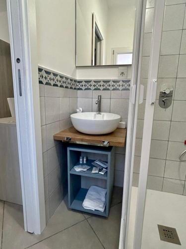 a bathroom with a sink and a mirror at THE PALACE B&B and Apartments in Santo Stefano di Camastra
