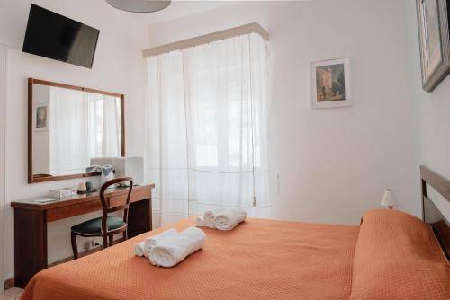 Postel nebo postele na pokoji v ubytování B&B La Formichella