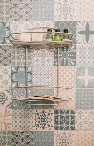 a room with a wall covered in tiles at B&B La Formichella in Maiori