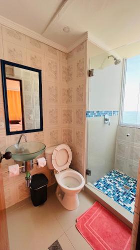 a bathroom with a sink and a toilet and a shower at Hotel Costa del Sol in Cartagena de Indias