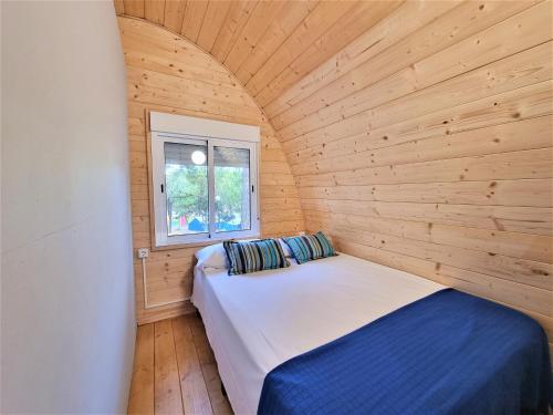 Voodi või voodid majutusasutuse Bungalow Nomad Harmonia toas