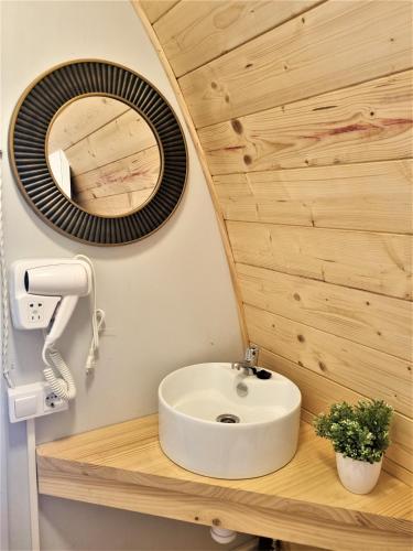 a bathroom with a white sink and a mirror at Bungalow Nomad Harmonia in L'Escala